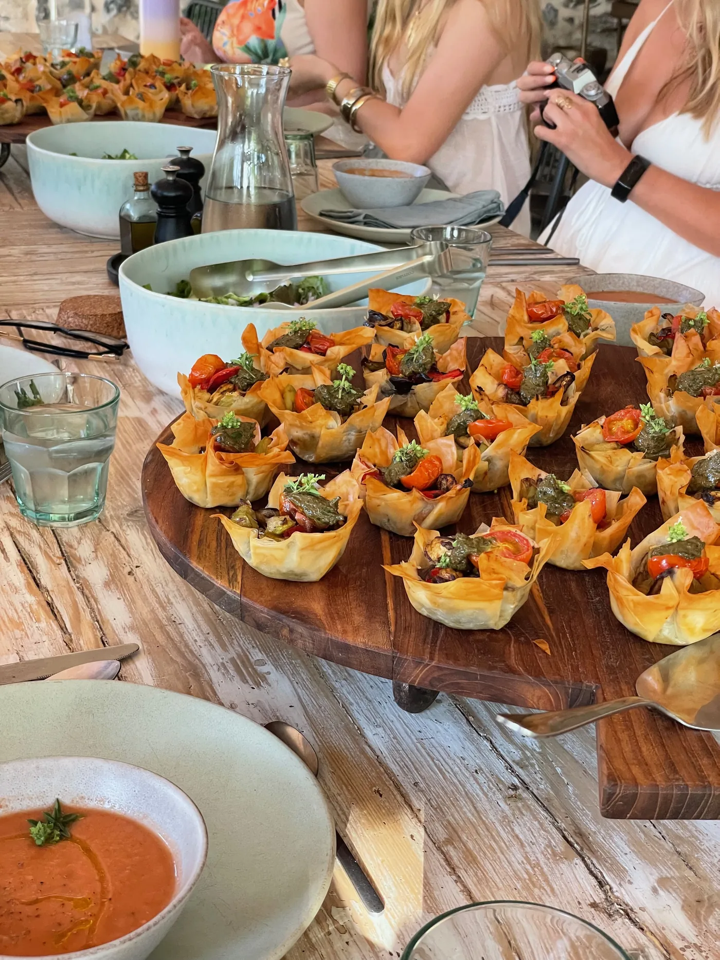 A shared plant-based lunch on the long table